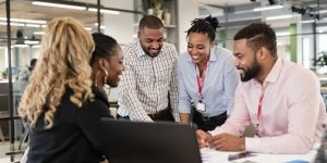 Diverse professionals collaborating in a modern office setting.